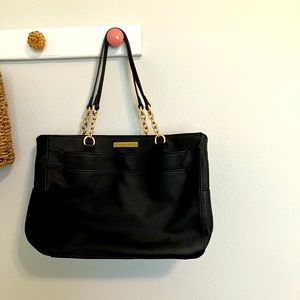 Black bag with lots of pockets. Great for work school or personal purse